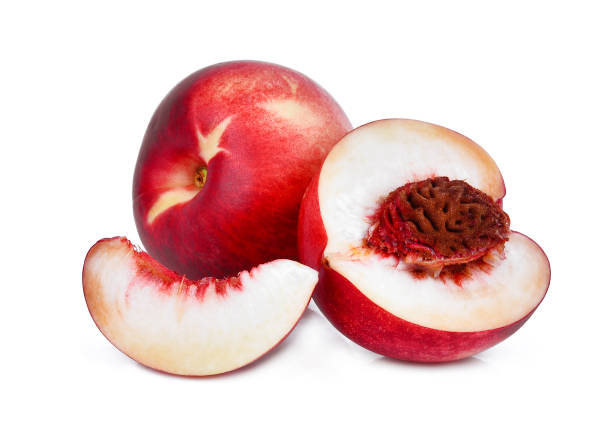 istock whole and half with slice of nectarine peach fruit isolated on whitie background 868916444