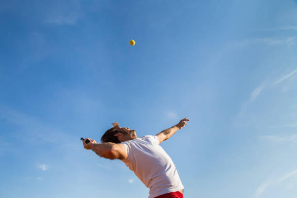istock Tennis player throwing ball 868920006