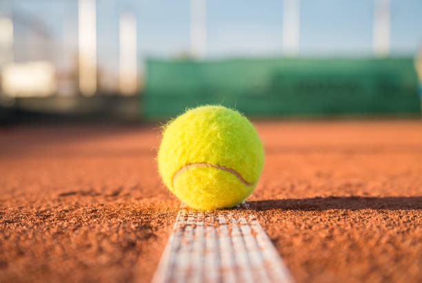 istock Tennis ball on white line 868920100
