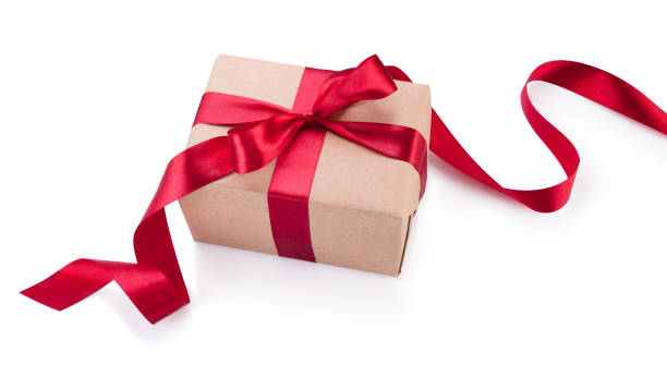 istock Kraft paper gift box with red ribbon bow from above isolated on white background 868920510