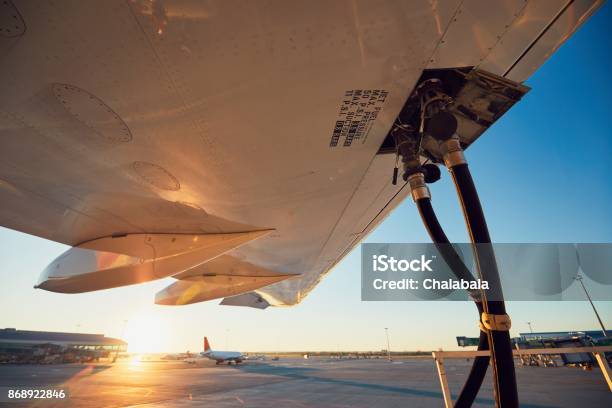 Refueling Of The Airplane Stock Photo - Download Image Now - Airplane, Fuel and Power Generation, Refueling