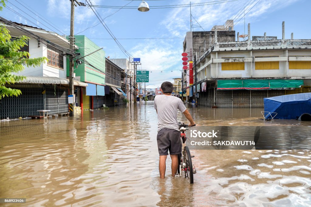 Flooded road during a flood caused by heavy rain Flood Stock Photo