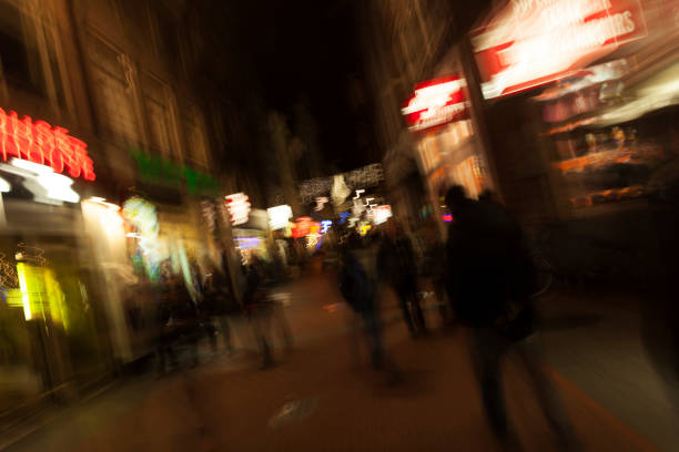 Motion blurred street at night in Amsterdam, The Netherlands