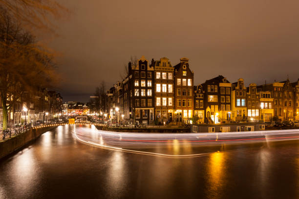 istock Amsterdam city canals illuminated at night 868923634