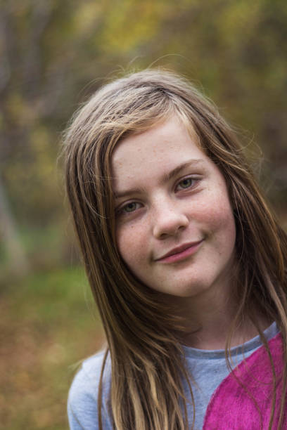 istock Joyful young lady posing in a natural environment. 868923790