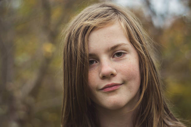 istock Joyful young lady posing in a natural environment. 868923842