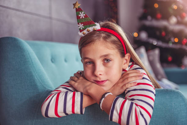 istock Little girl posing on sofa 868924502