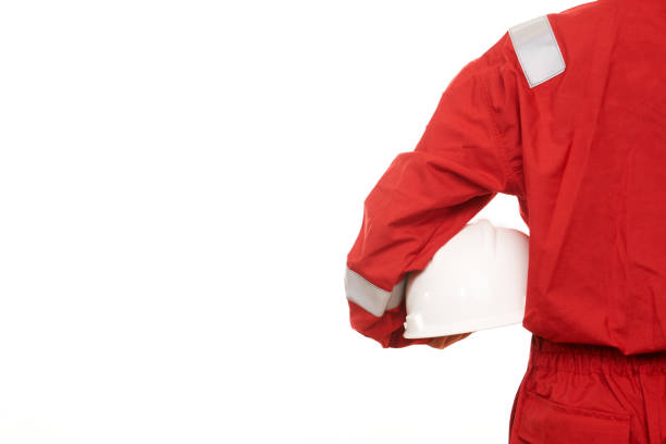 istock Woman construction worker holds helmet in hand 868931724
