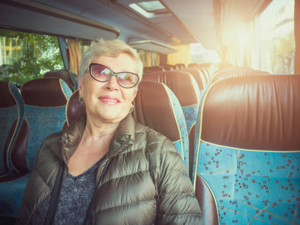 istock Senior woman  in the bus 868935470