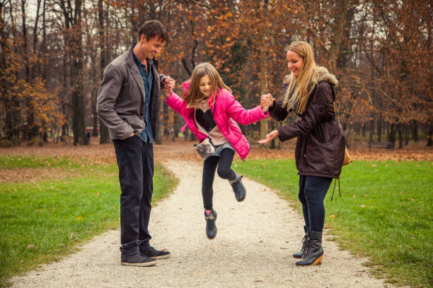 istock Family of three in park 868935794