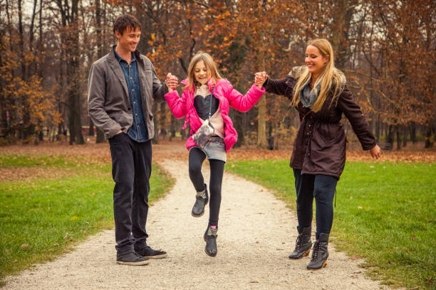 istock Family of three in park 868935982