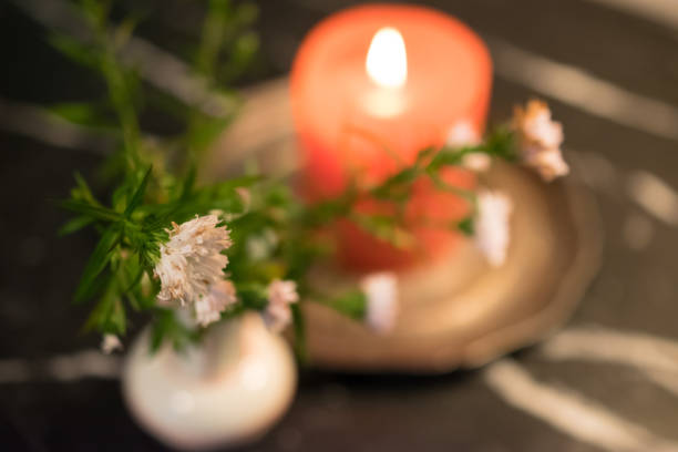 Red Candle and white flowers