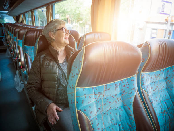 istock Senior woman  in the bus 868936258