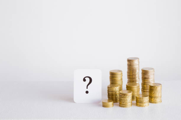 istock Question mark with coins stack on the gray background. Money offer concept. Mock up for different business ideas. Empty place for a text. 868936666