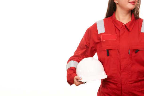 istock Woman construction worker holds helmet in hand 868936748
