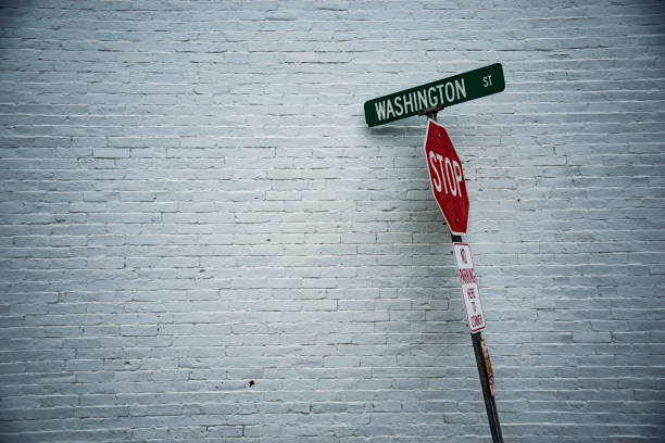 istock Road sign in front of a white wall 868944886