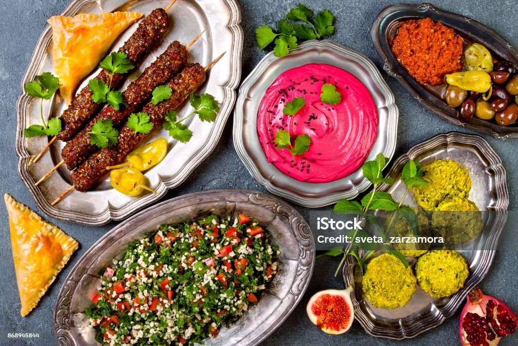 Middle Eastern traditional dinner. Authentic arab cuisine. Meze party food. Top view, flat lay, overhead Food Stock Photo