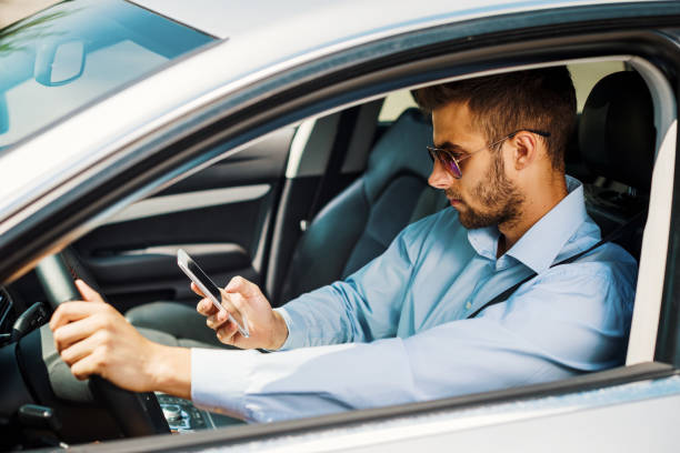 istock Man using car pooling service app on his smartphone 868950820