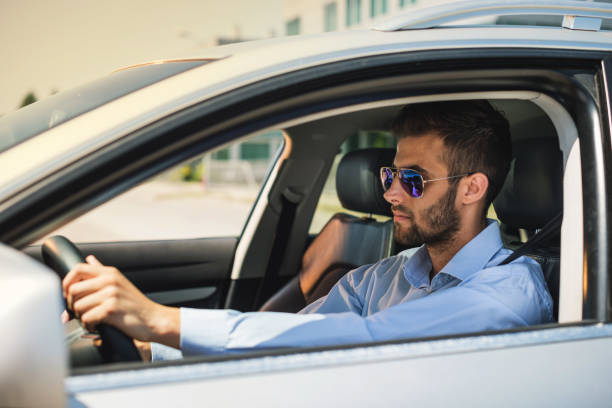 istock Successful businessman standing on traffic lights while commuting to work 868951020