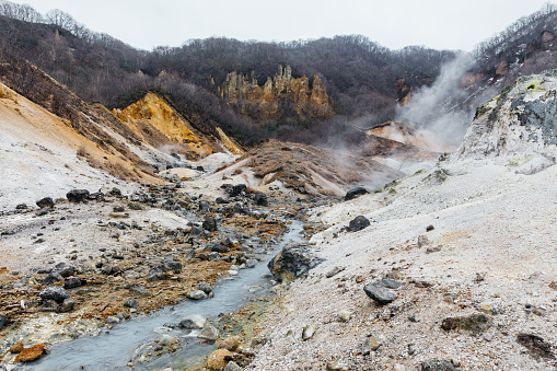 Mineral lake in Noboribetsu Jigokudani (Hell Valley): The volcano valley got its name from the sulfuric smell, extremely high heat and steam spouting out of the ground in Hokkaido, Japan.