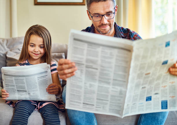 istock Reading the news, just like her dad 868951468