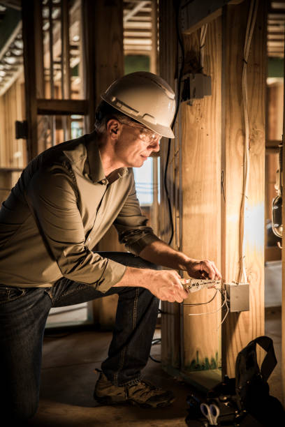 istock Woman electrician at home construction site. 868955410