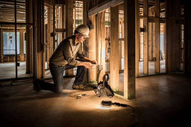 Woman electrician at home construction site. stock photo