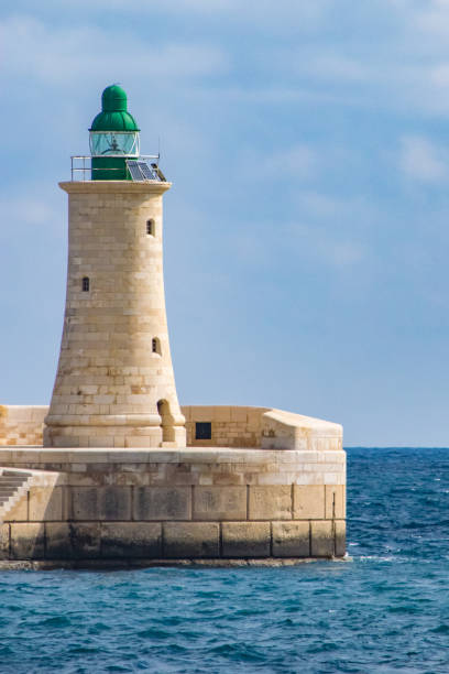 istock Lighthouse at the end of the breakwater in Valletta. 868958460