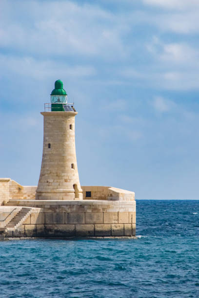 istock Lighthouse at the end of the breakwater in Valletta. 868958510