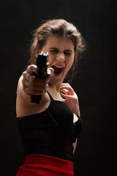 istock woman with gun 868959508