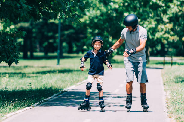 istock Roller skating, summer fun with grandfather 868962098