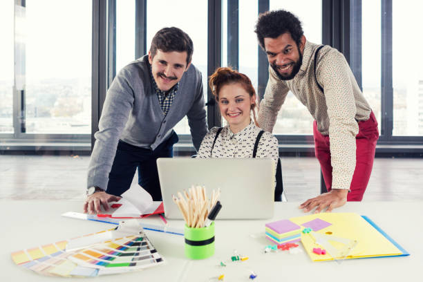 istock Business people in modern office posing for camera. 868962410
