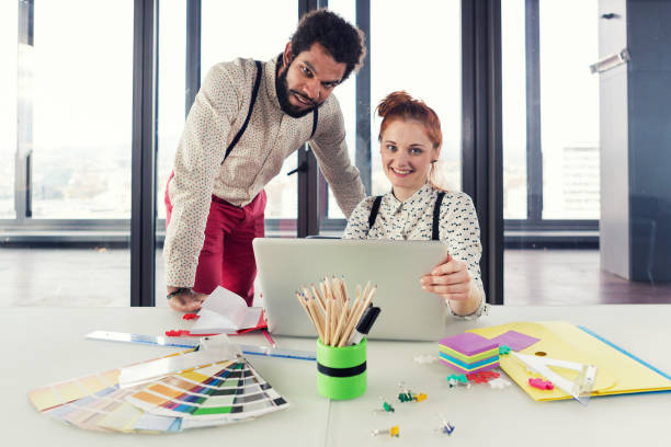 istock Business people in modern office posing for camera. 868962568