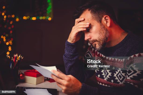 Worried Men Cheeking His Mail Late Night Stock Photo - Download Image Now - Christmas, Debt, Emotional Stress