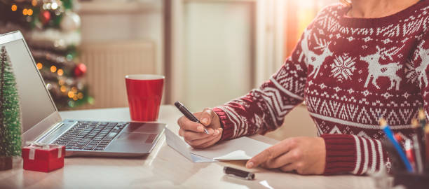 istock Women writing christmas letter 868970130