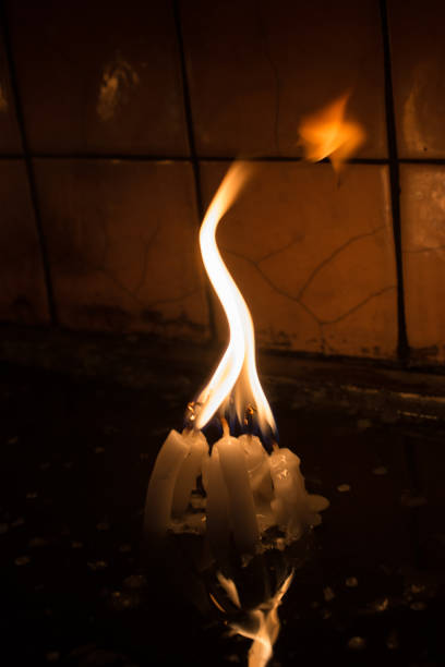 istock Burning candles give light in the dark 868970360