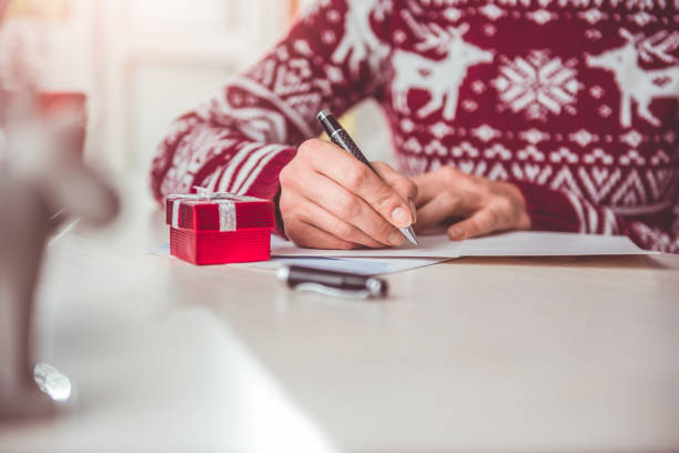 istock Women writing christmas letter 868971704