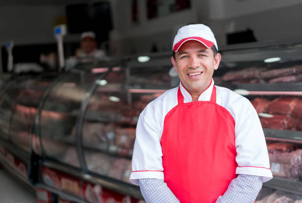 istock Man working at the butcher's shop 868972670