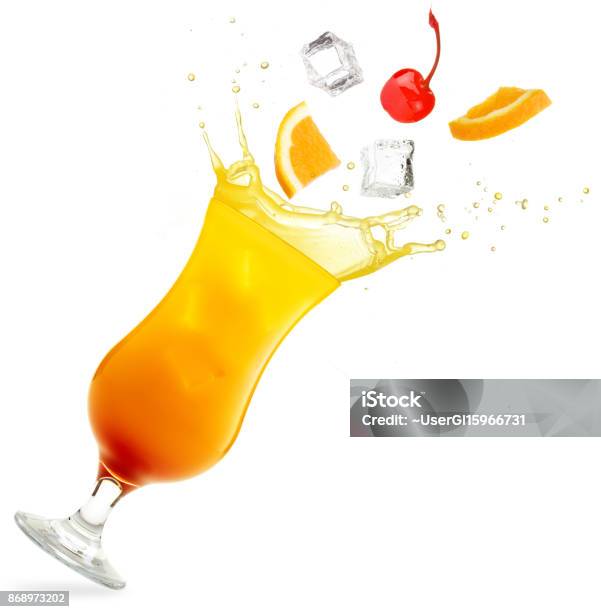 Tequila Sunrise Cocktail Splashing Isolated On White Stock Photo - Download Image Now