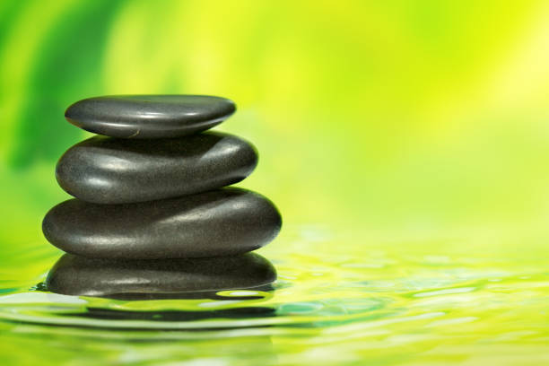 Fresh green background with water flowing from bamboo