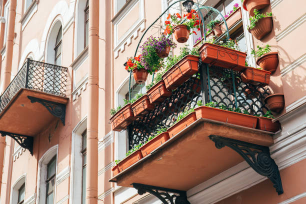 istock Balcony of an old building with flower pots 868978664