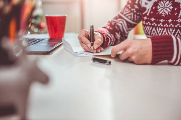 istock Women writing christmas letter 868979422