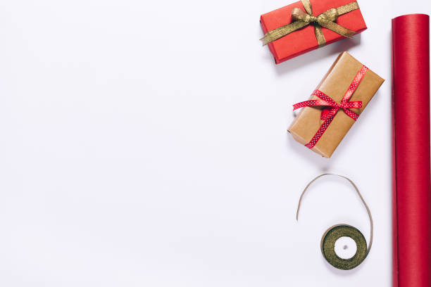 istock Gift boxes with ribbons and red wrapping paper 868981576
