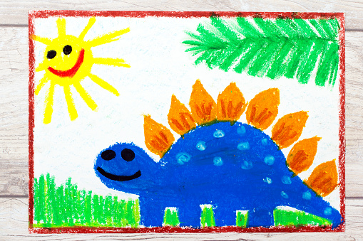 Photo of colorful drawing: Smiling dinosaur. Big blue stegosaurus.