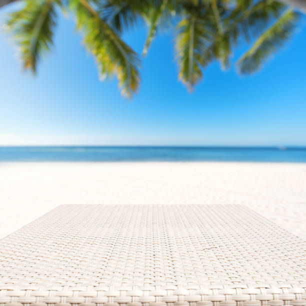 Wood weave table surface and tropical beach background