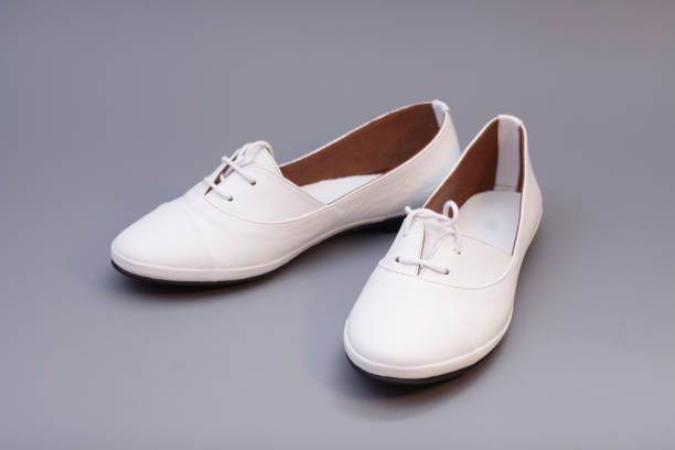 istock White Shoes isolated on gray background 868983112