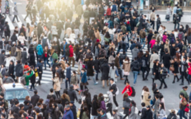 Defocused picture of crowd of people at the city, Asia Defocused picture of crowd of people at the city, Asia population explosion photos stock pictures, royalty-free photos & images