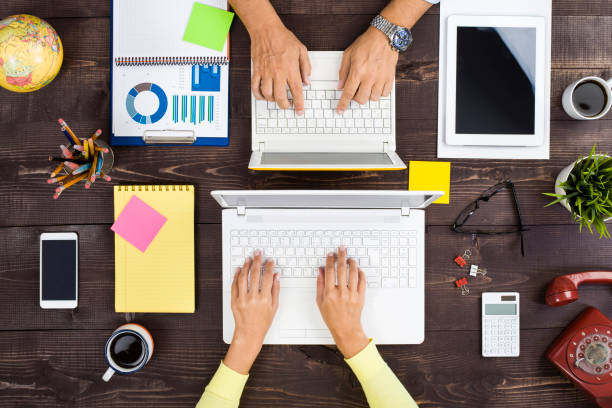 istock Man and woman working 868987698