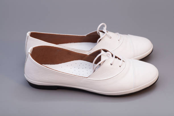 istock White Shoes isolated on gray background 868988030