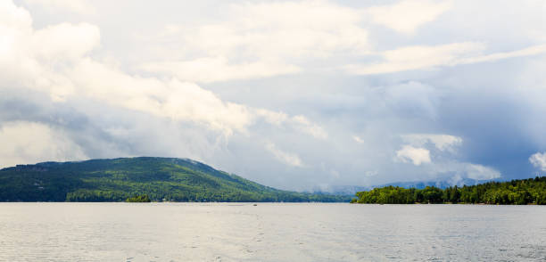 istock Lake George from the paddle boat during rain storm and clouds. 868988940